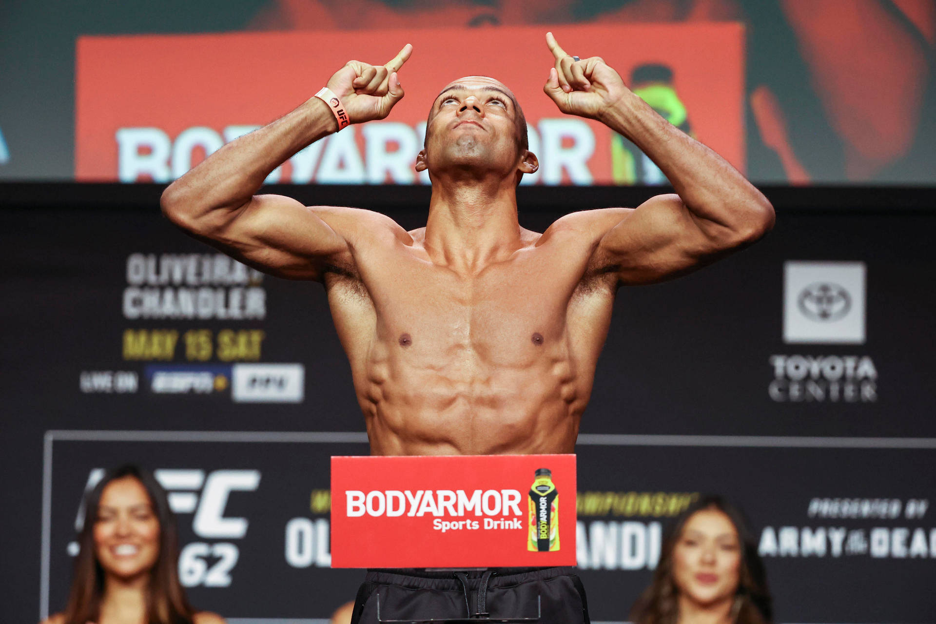 Shirtless Edson Barboza Pointing Up Background