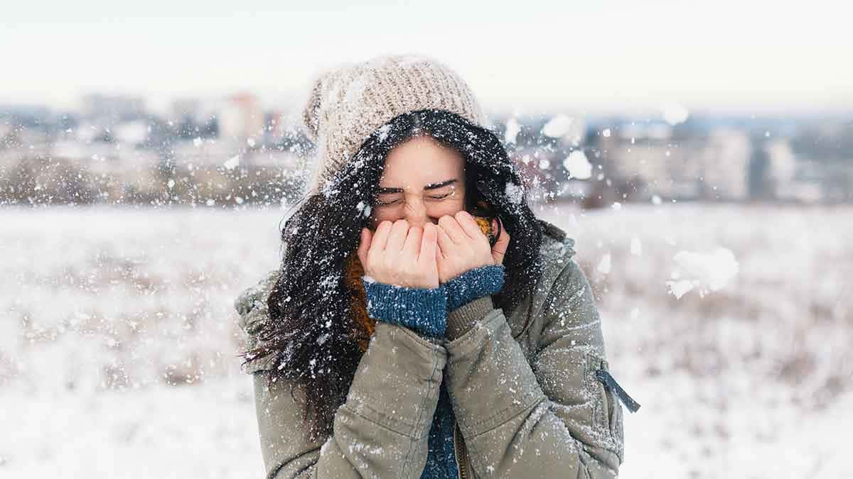 Shivering Woman Covering Mouth [wallpaper] Background