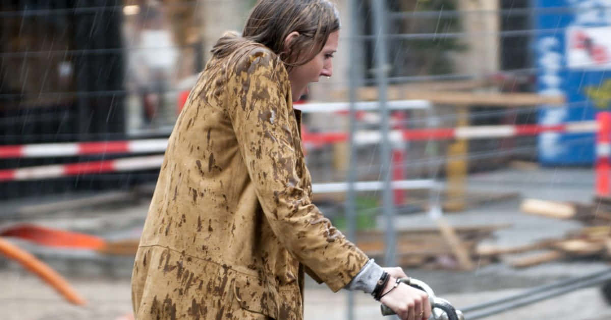 Shivering Woman In Rain [wallpaper] Background