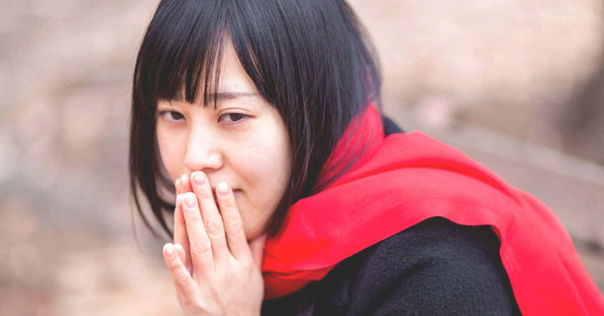 Shivering Woman In Red [wallpaper] Background