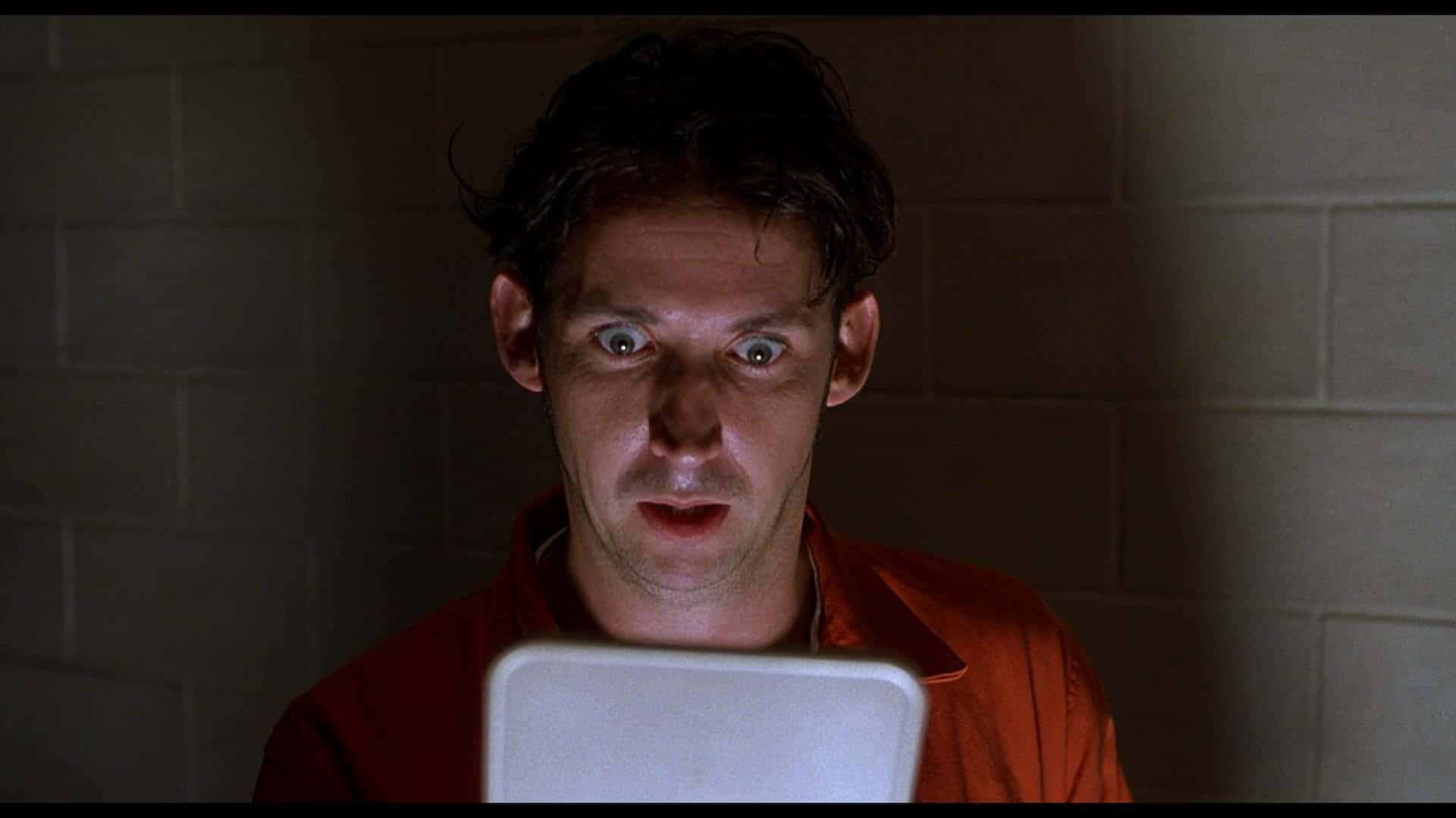 Shocked Manin Orange Jumpsuit Background