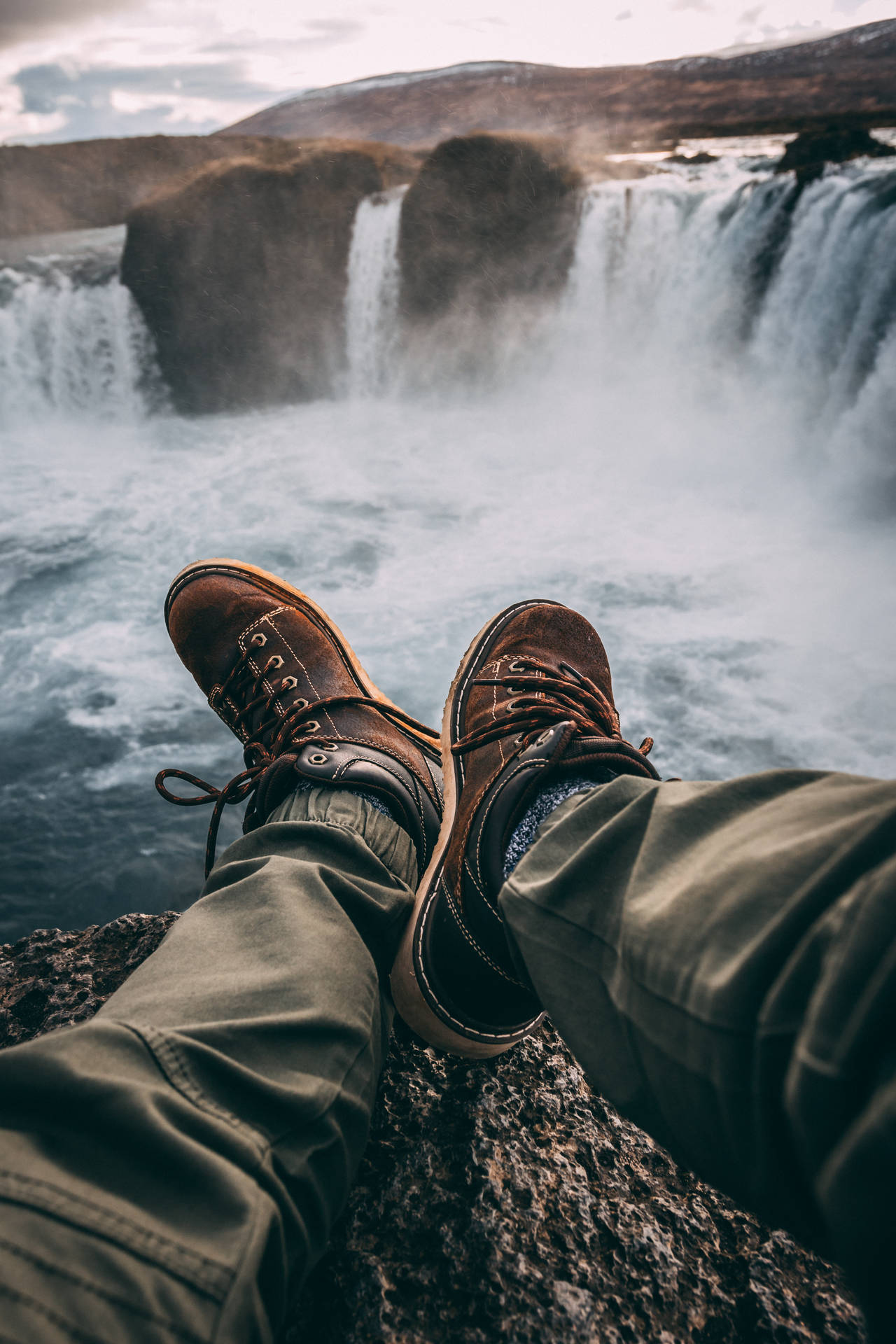 Shoes By A Waterfall Background