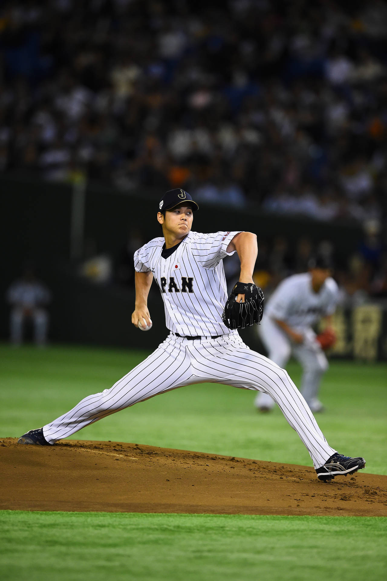 Shohei Ohtani In Baseball Action Background