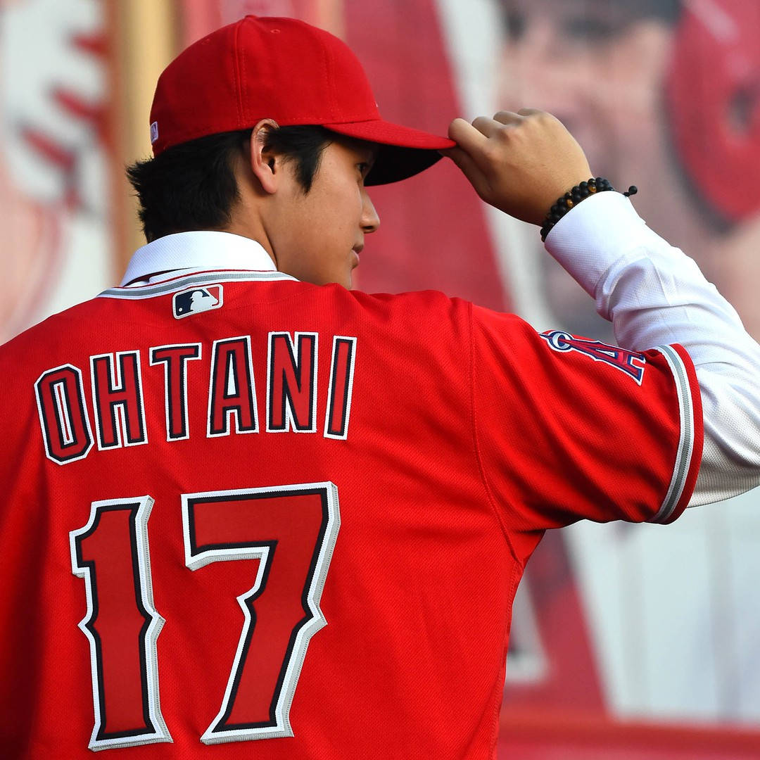 Shohei Ohtani Tipping His Cap Side View Background