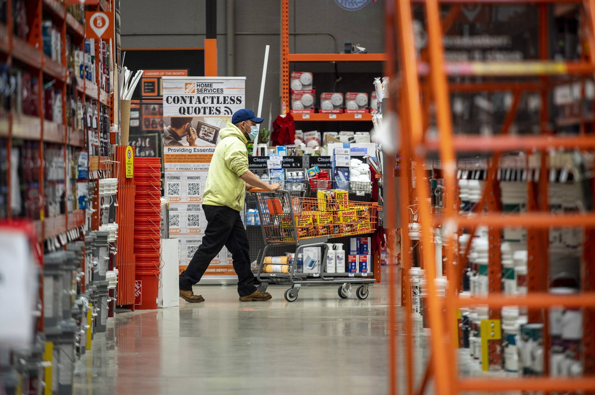 Shopper Perusing Aisles At Home Depot During Pandemic Background