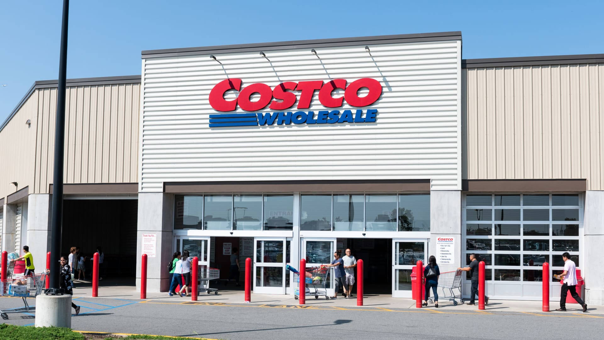 Shoppers Browsing Various Products At Costco