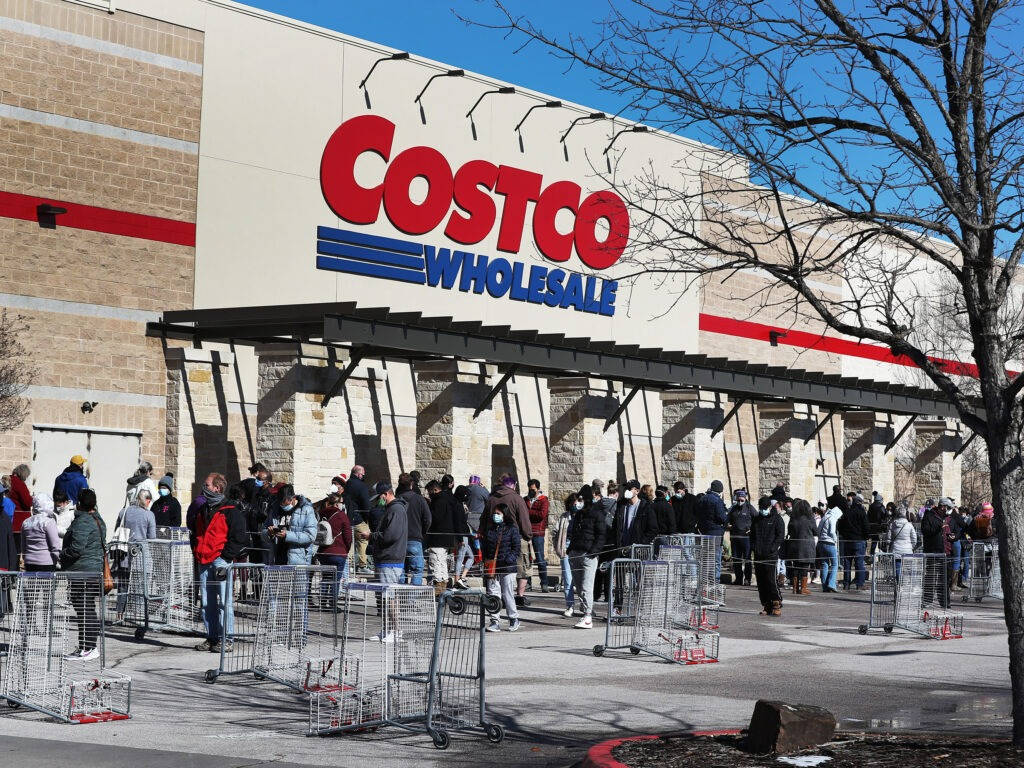 Shoppers Lining Outside Costco Store Background