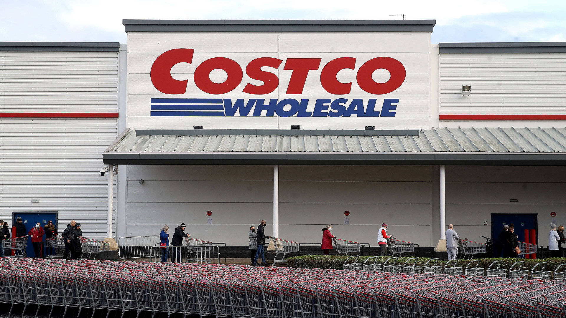 Shoppers Push Carts Costco Background