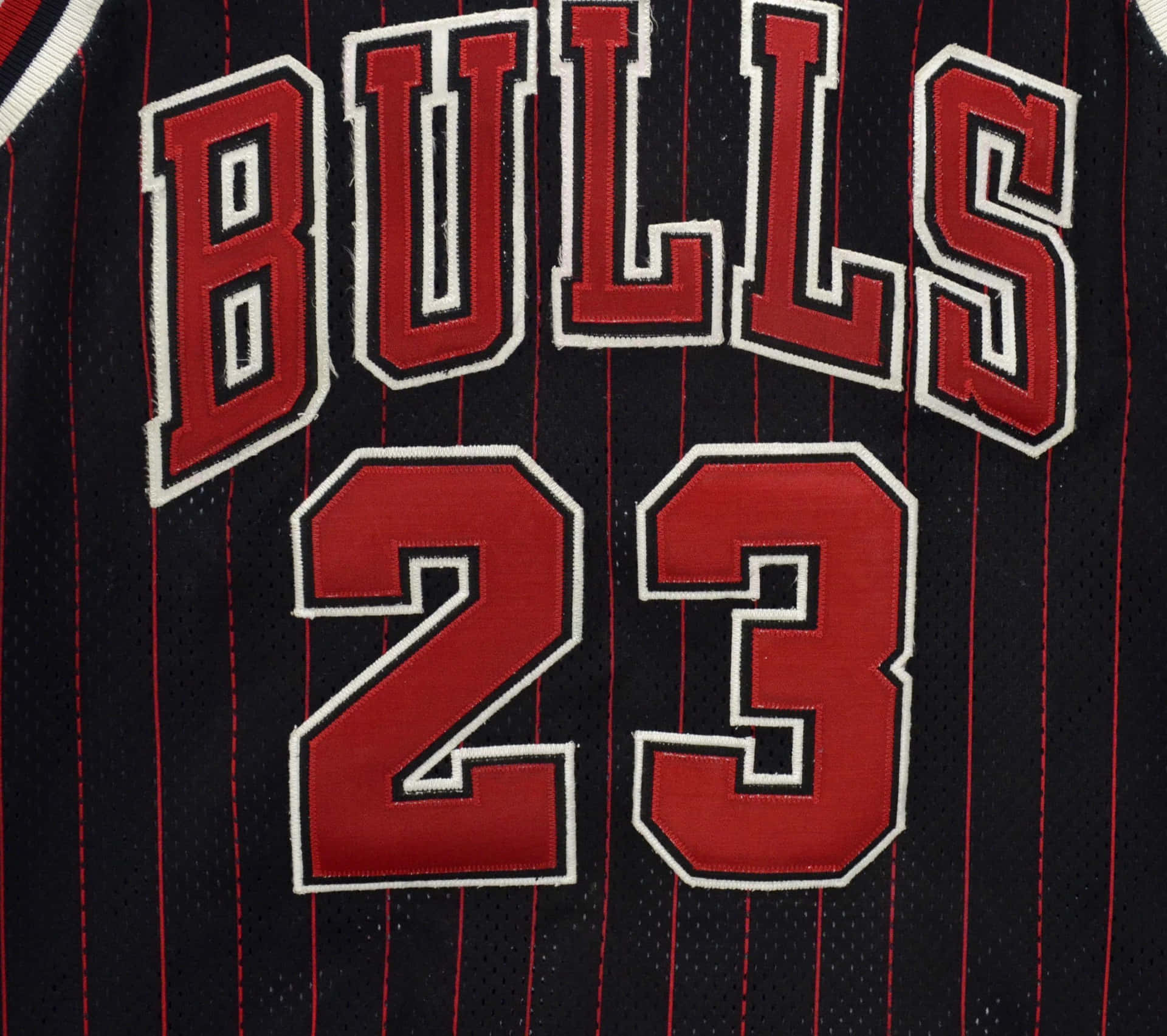 Show Your Love And Passion For Basketball By Proudly Wearing A Classic Michael Jordan Jersey Background