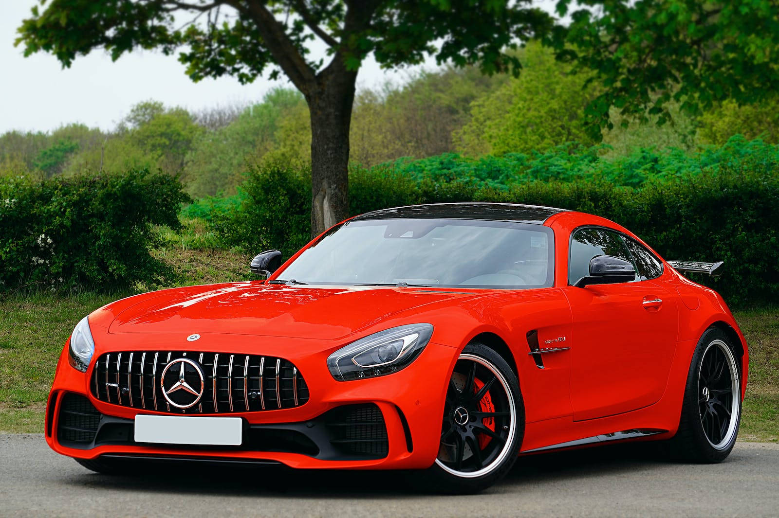 Showcasing Speed And Elegance: Red Mercedes-amg Gt Luxury Car Background