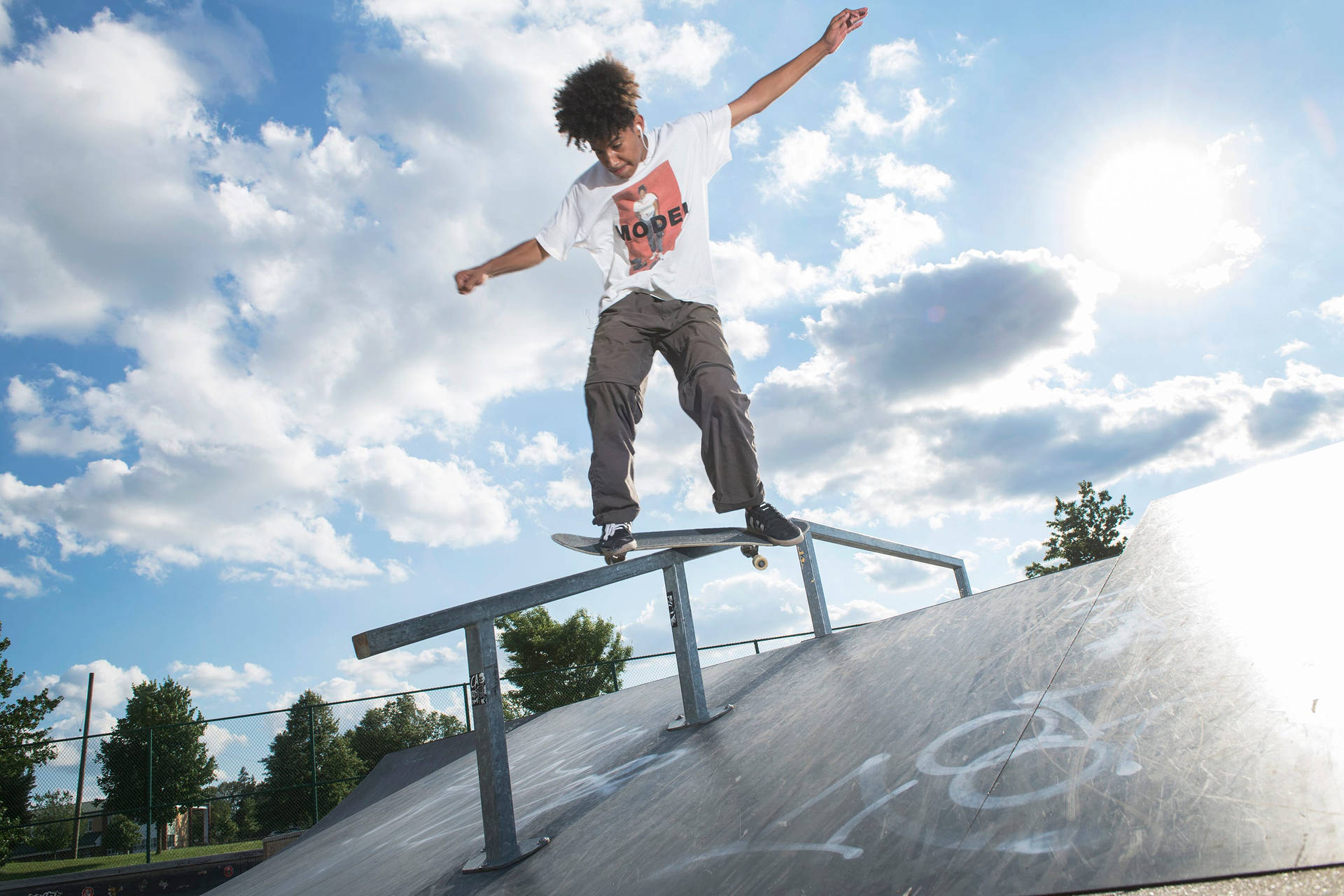 Shredding The Street: An Urban Skateboarder In Action Background