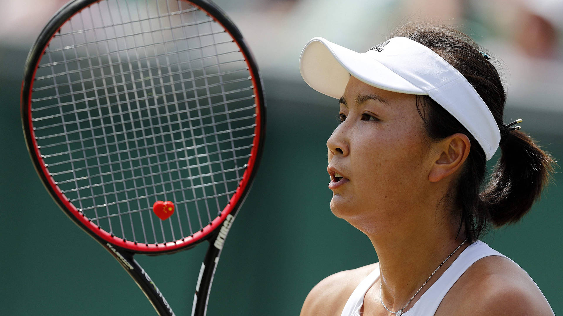 Shuai Peng With Her Racket Background