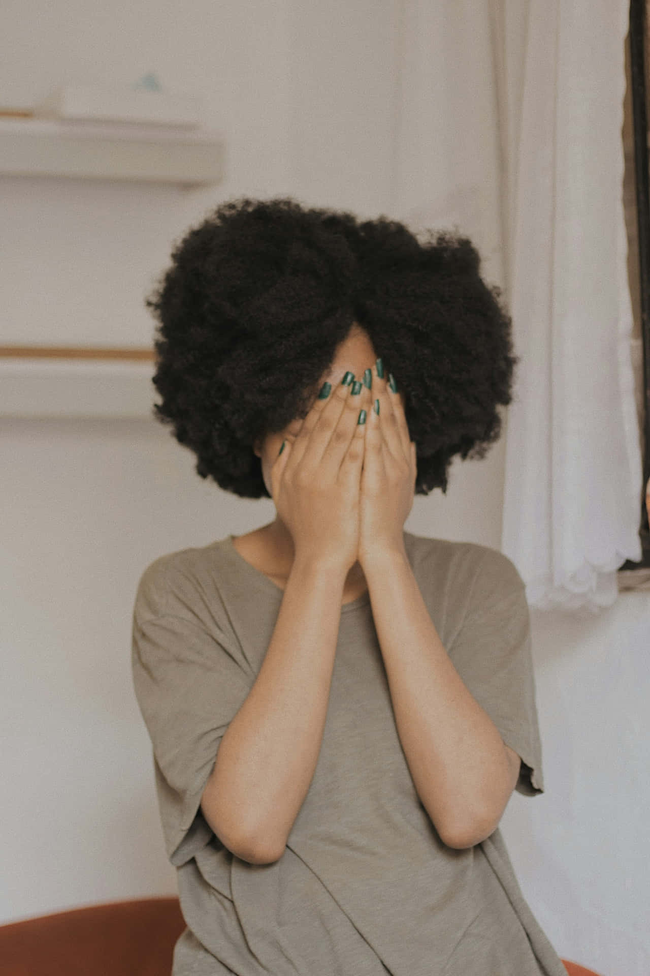 Shy Person Covering Face
