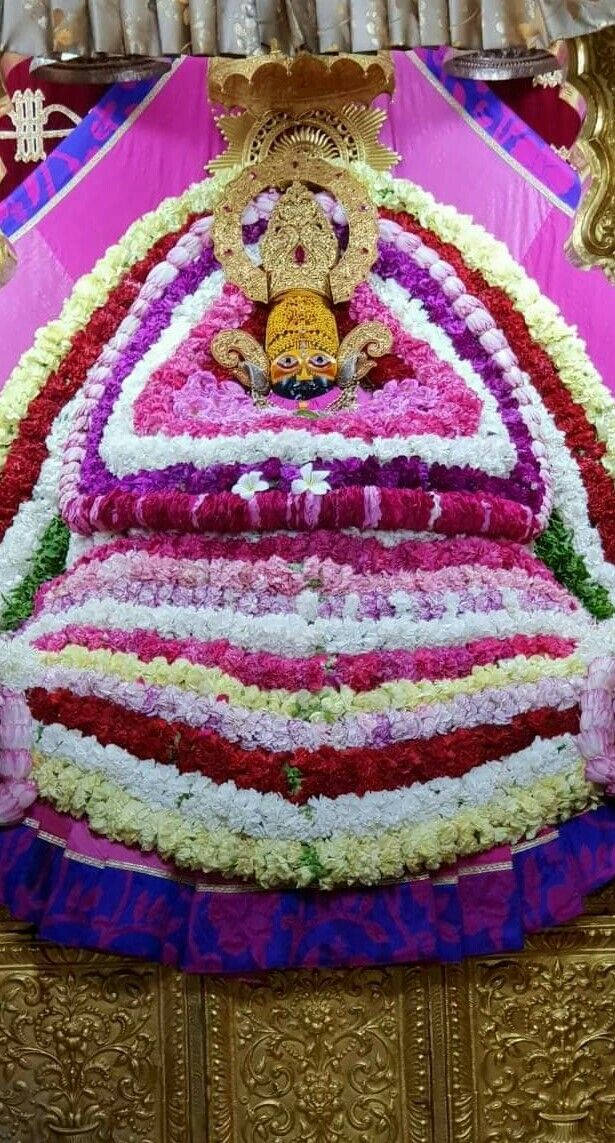 Shyam Baba Statue On Gold Table Background