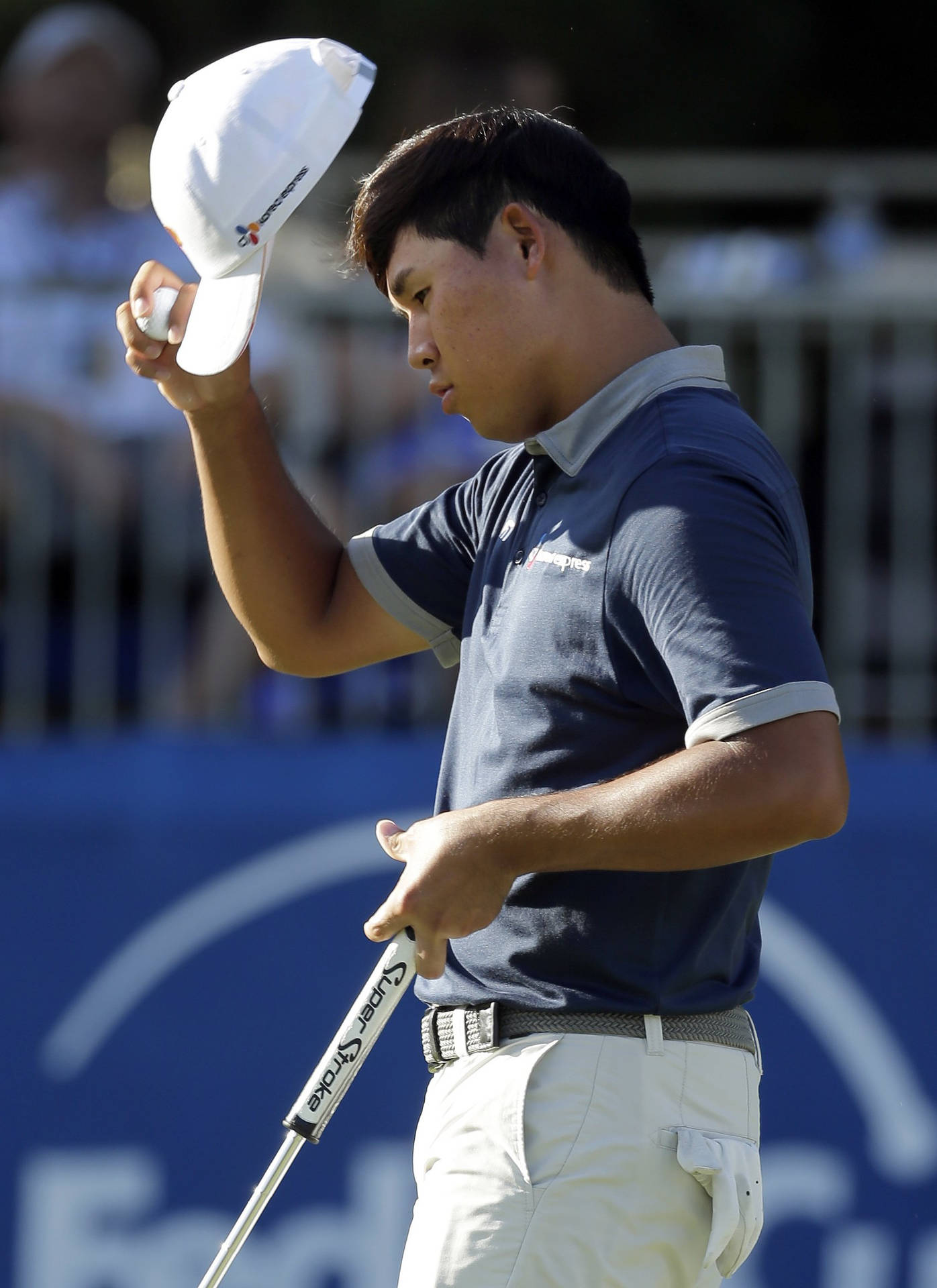 Si Woo Kim Removing His Cap Background