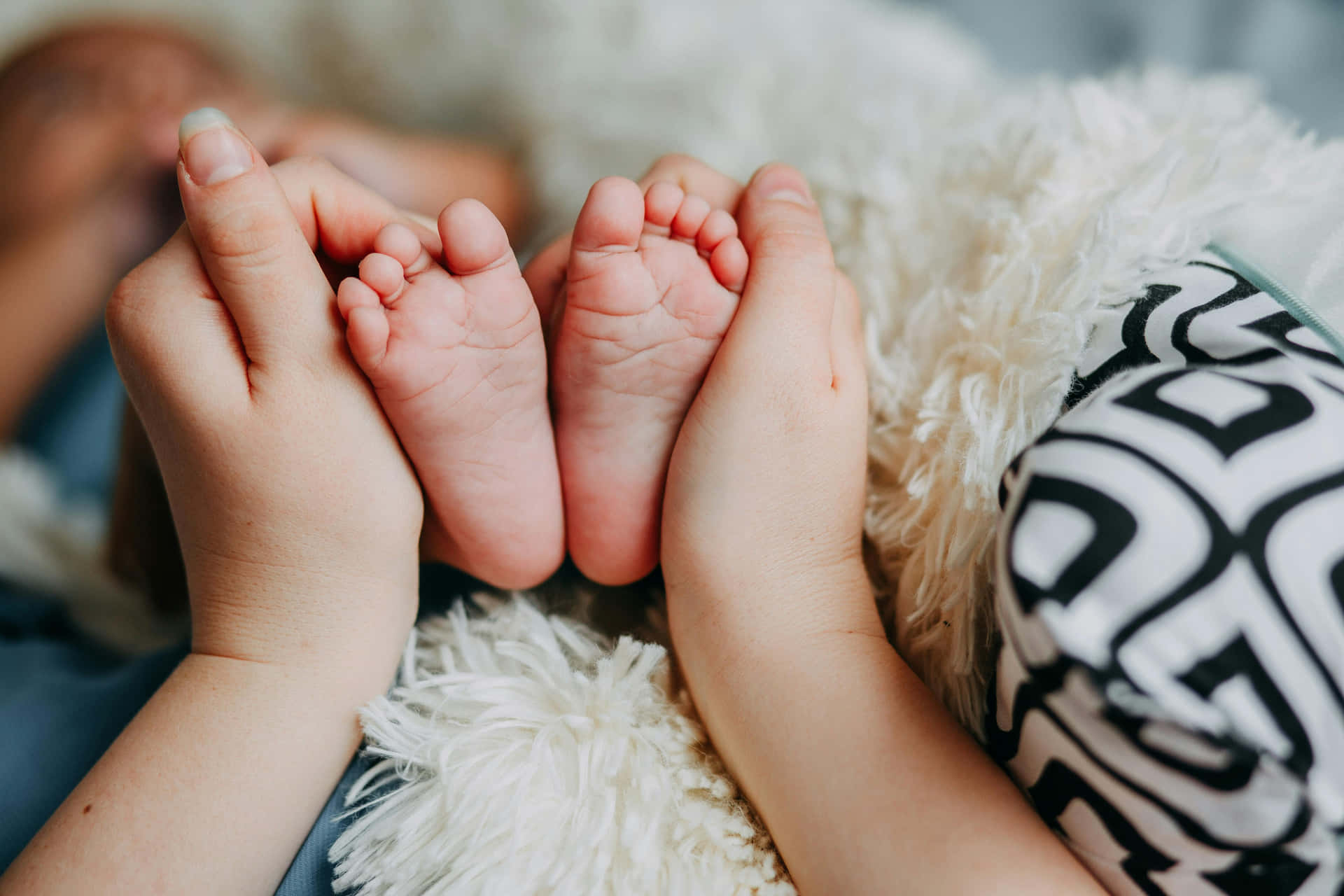 Sibling Bonding Moment Baby Feet Background