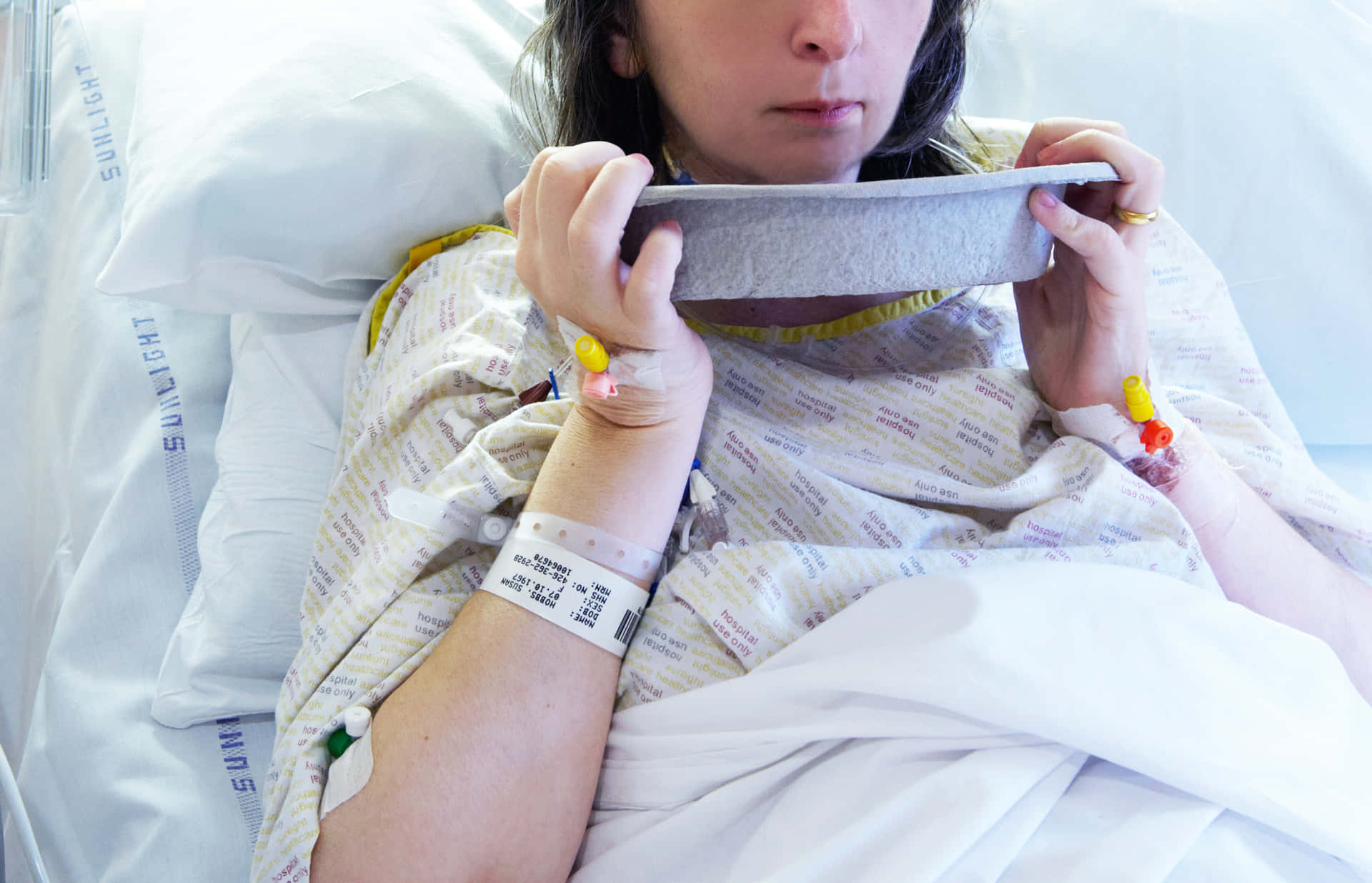 Sick Patient Dealing With Nausea In Hospital Background