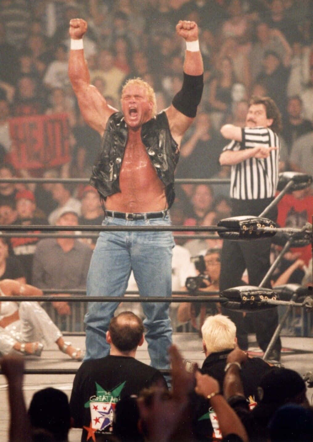 Sid Vicious Inside The Ring With His Hands Up Background