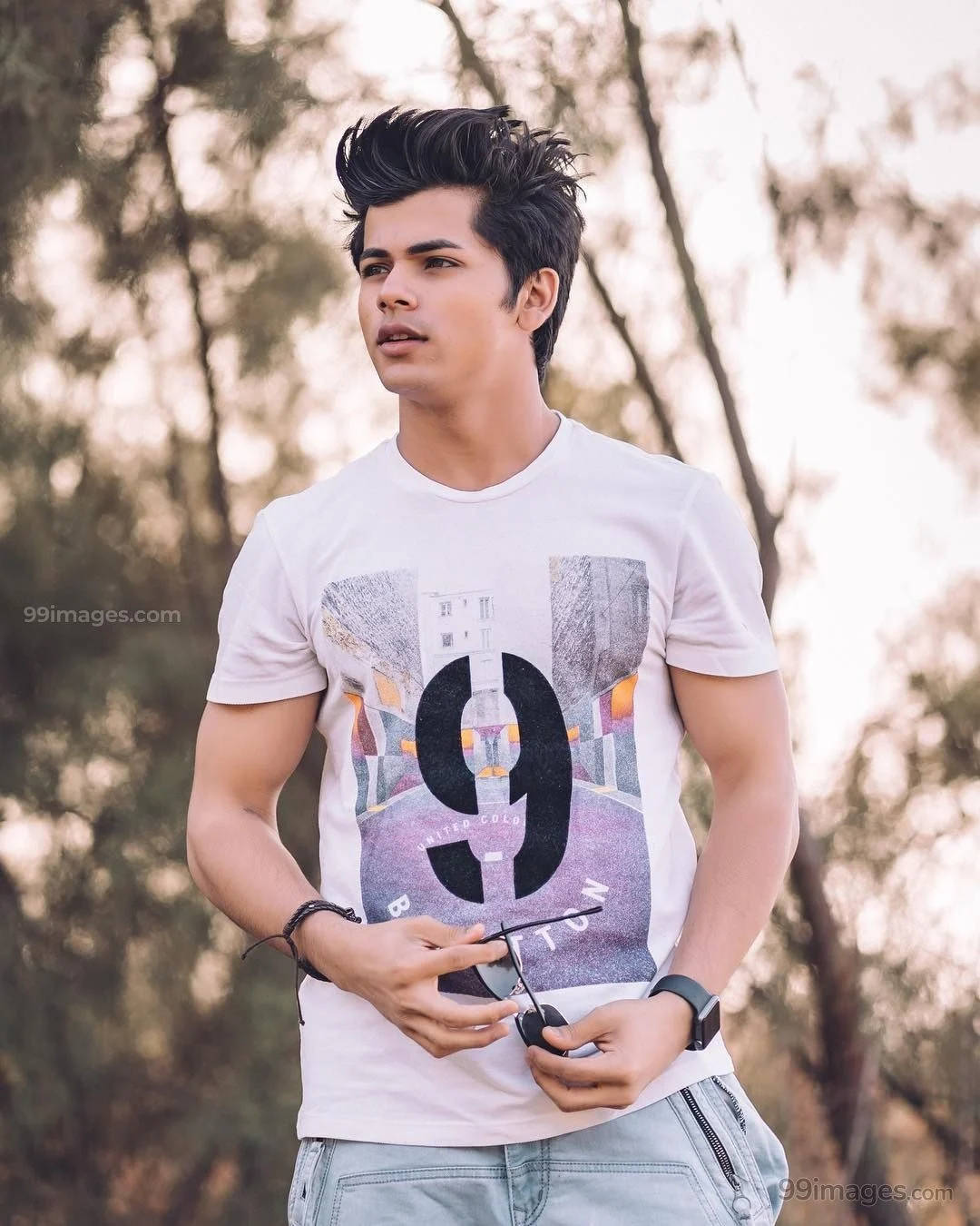 Siddharth Nigam Holding Sunglasses Background