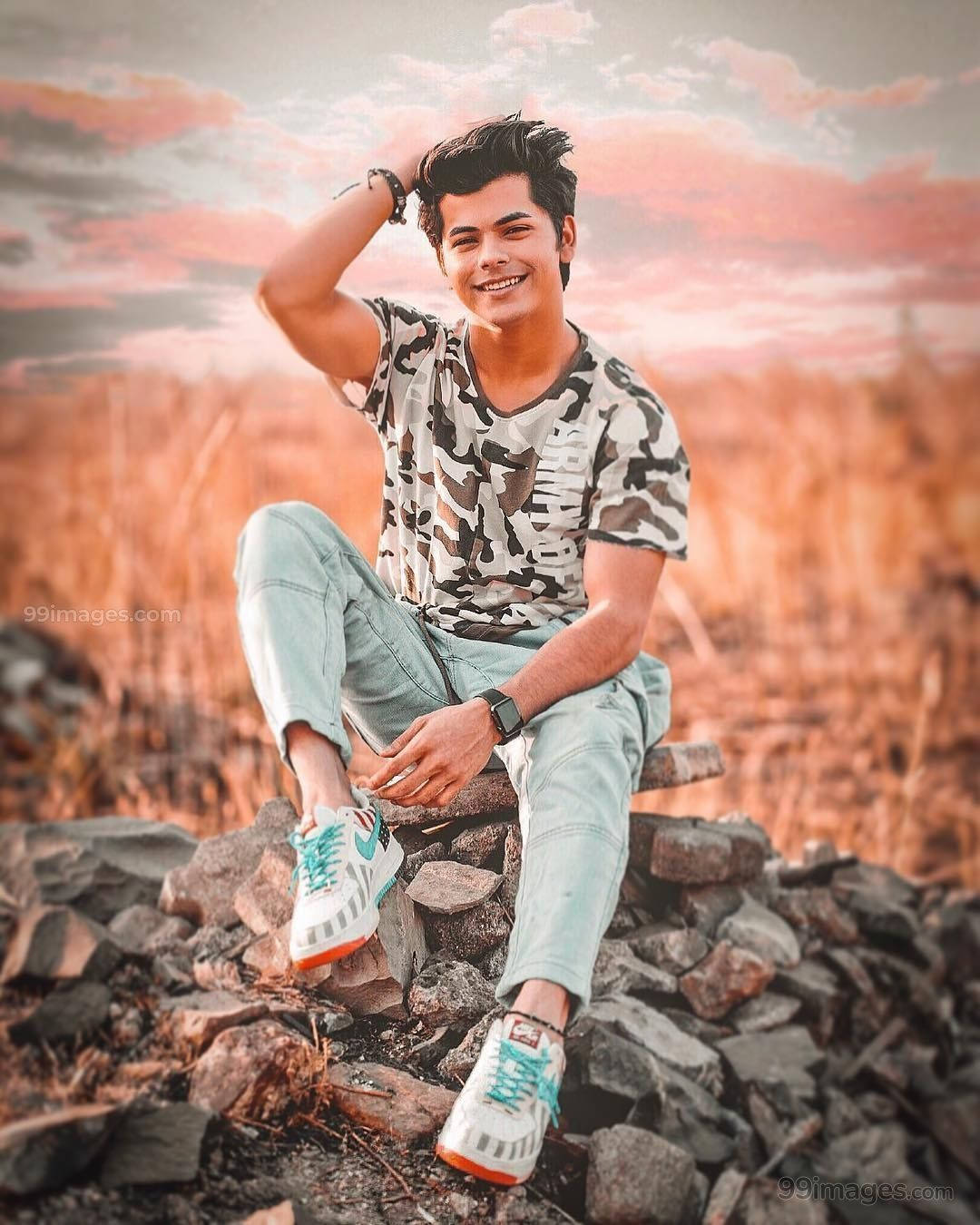 Siddharth Nigam On Rocks Background