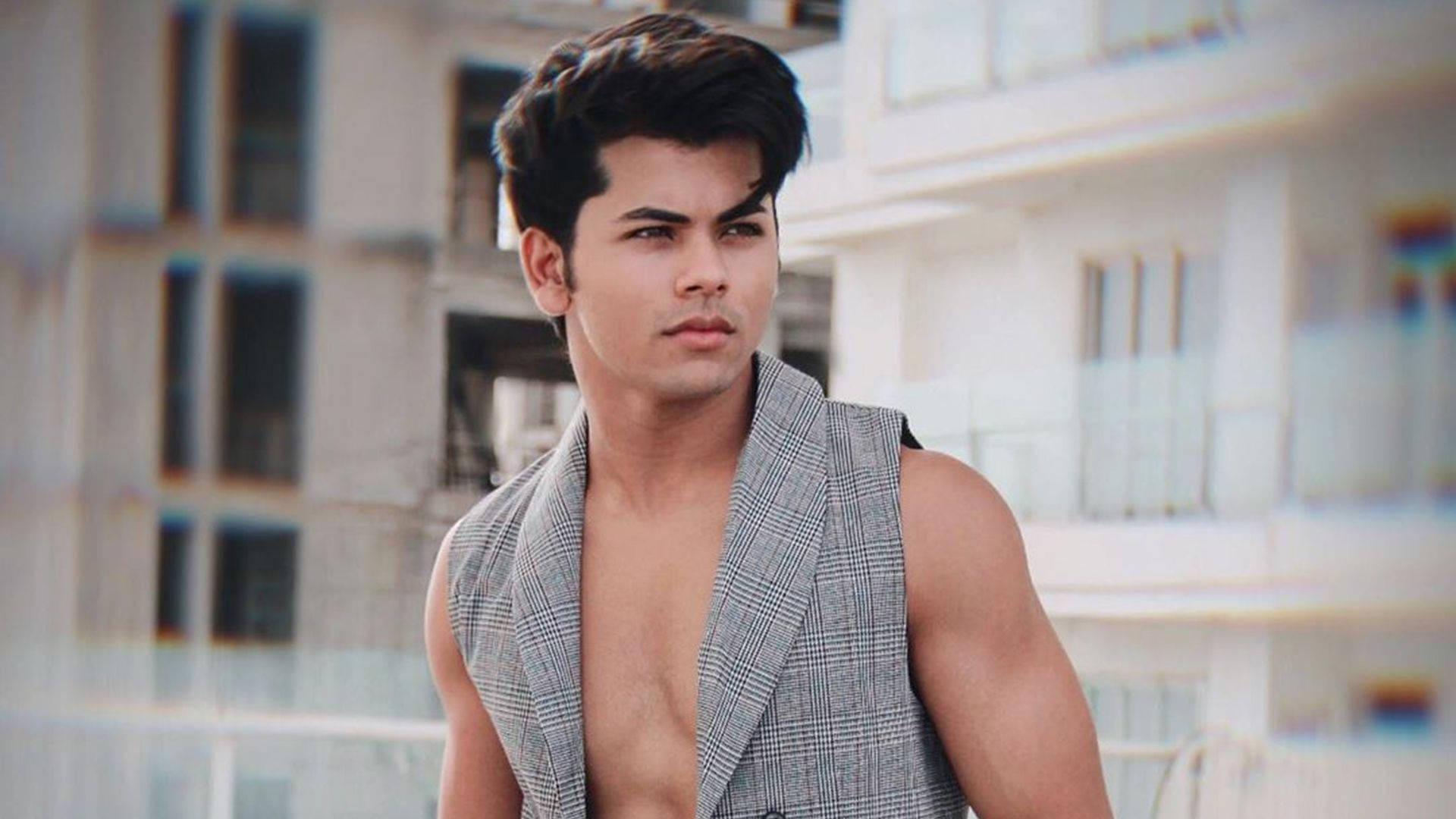 Siddharth Nigam Open Vest Background