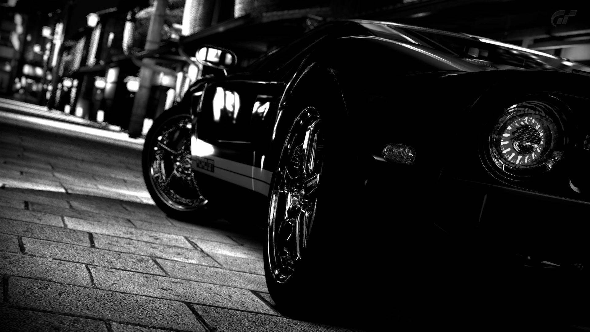 Side-angle Of Black Sports Cars Background