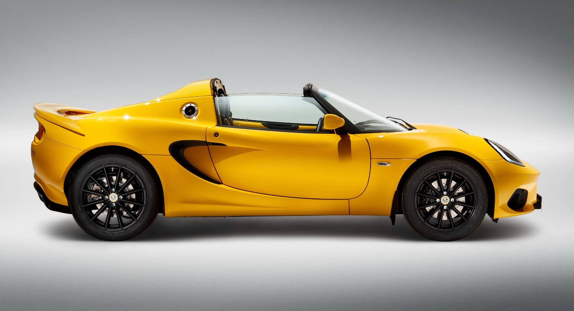 Side Perspective Of A Vibrant Lotus Elise Sports Car.