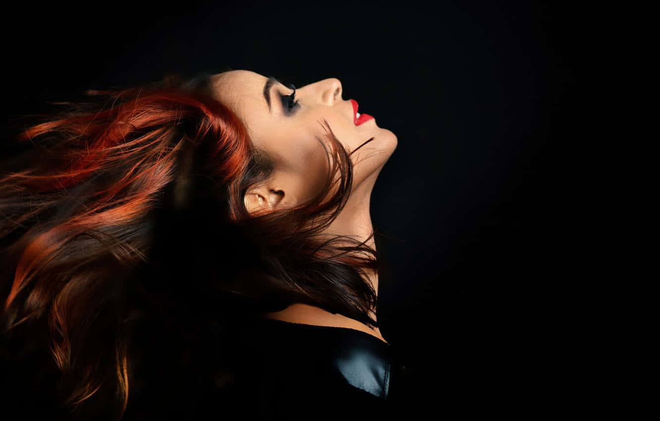 Side Profile Model's Flowing Red Hair