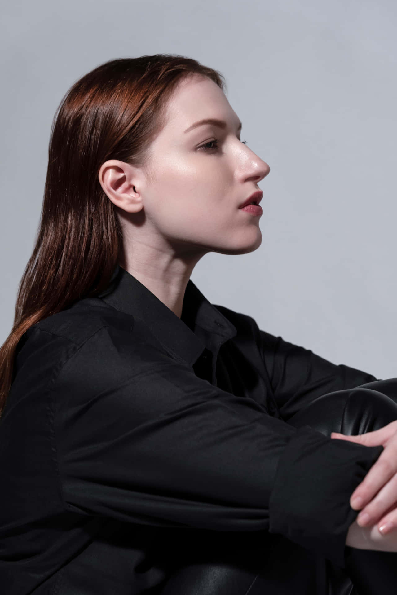 Side Profile Model With Red Hair Background