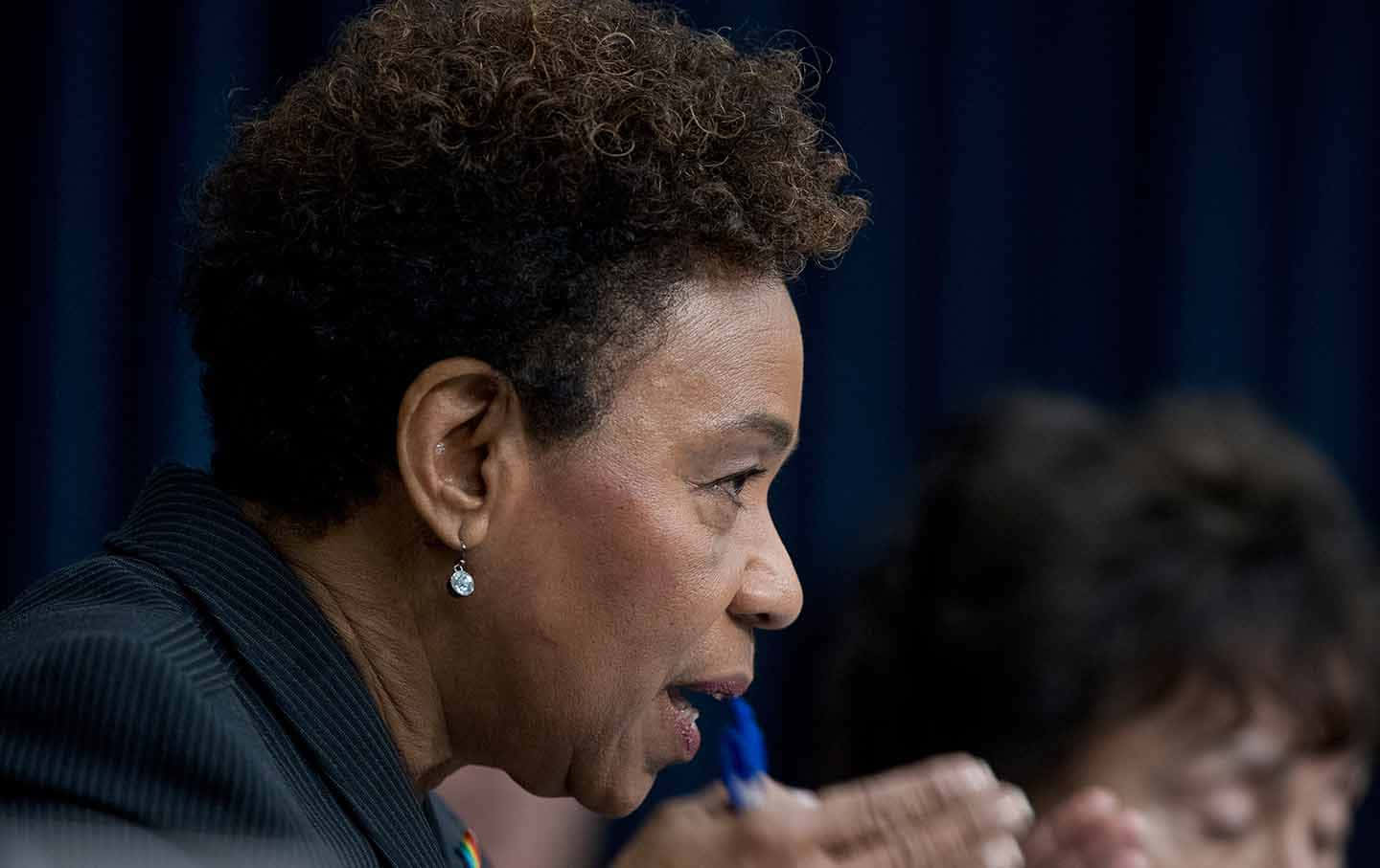 Side Profile Of Barbara Lee Background