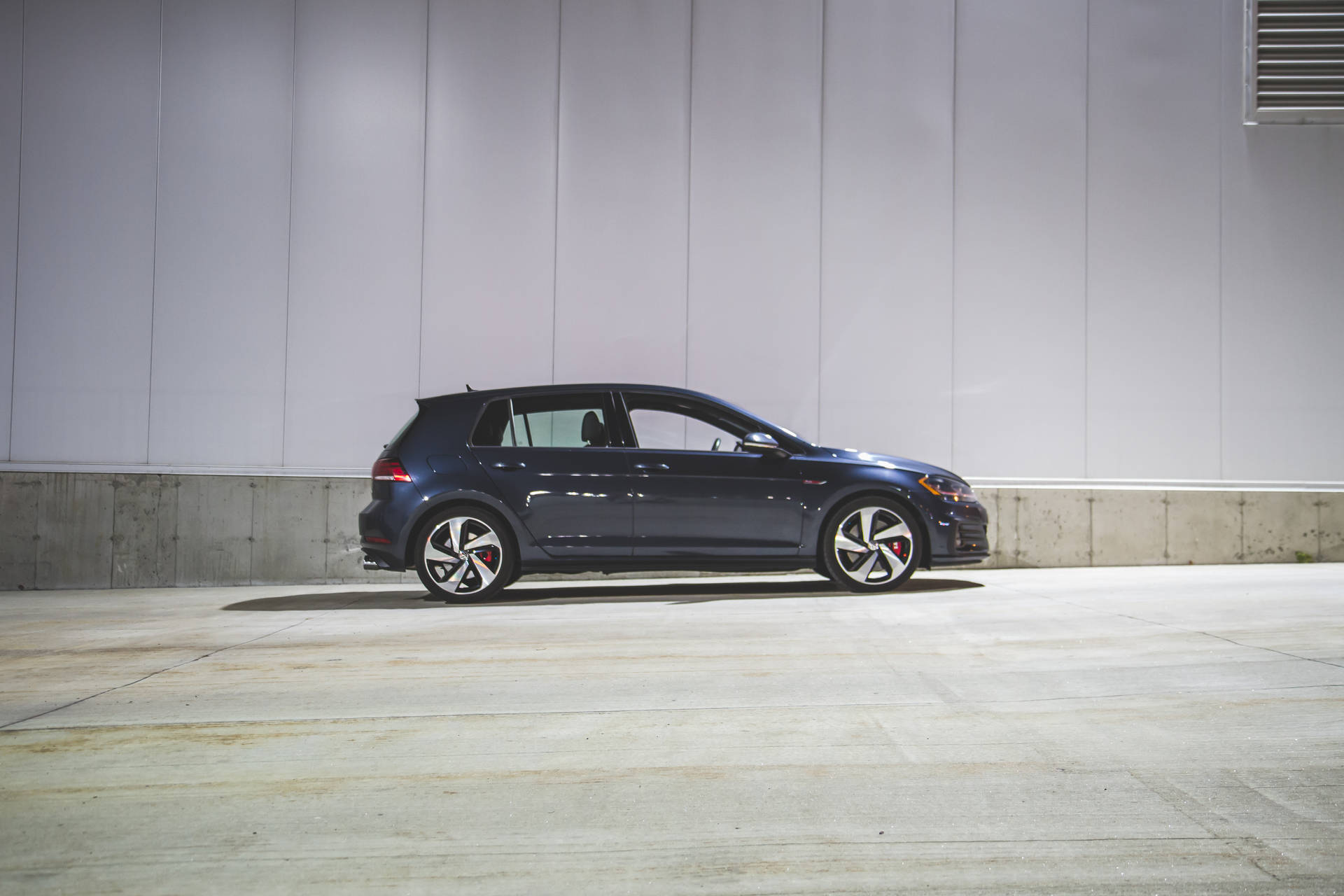 Side-view Of Blue Volkswagen Golf Gti Background