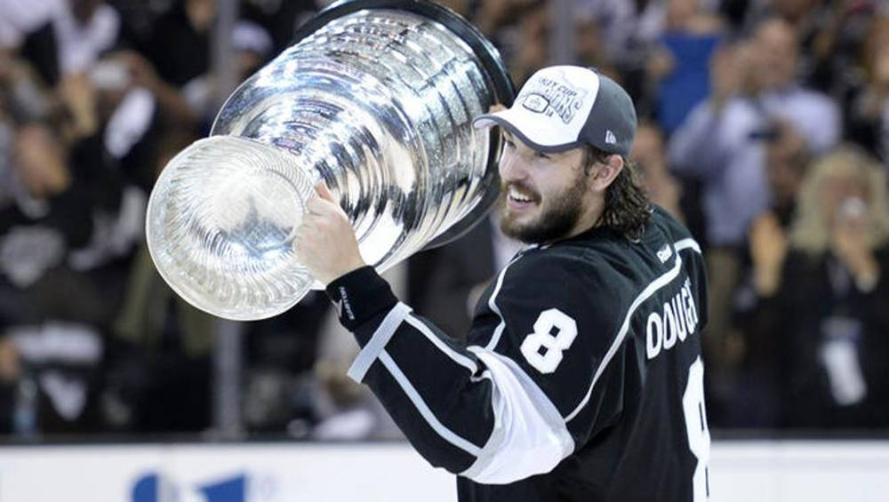 Side View Of Drew Doughty Happily Holding The Stanley Cup Background