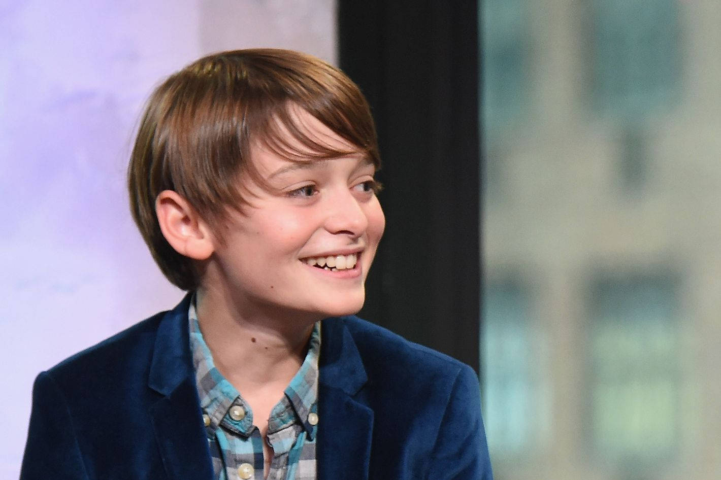 Side View Of Young Noah Schnapp Background