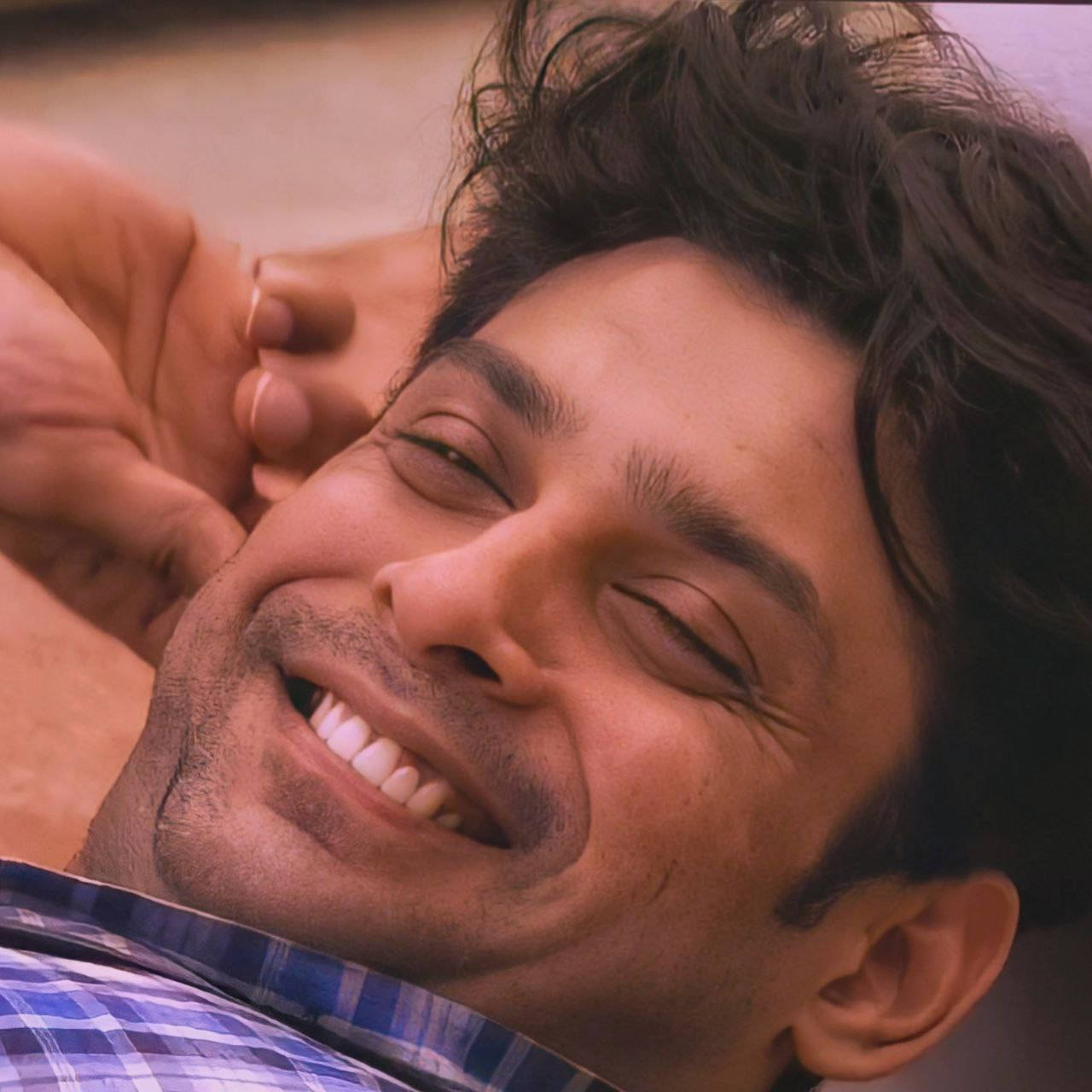 Sidharth Shukla On His Back Close-up Background