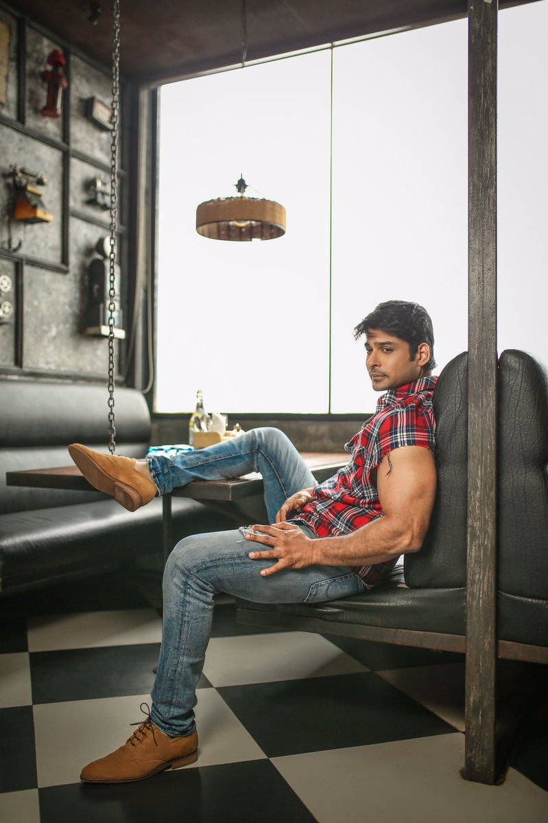 Sidharth Shukla Sitting By A Table