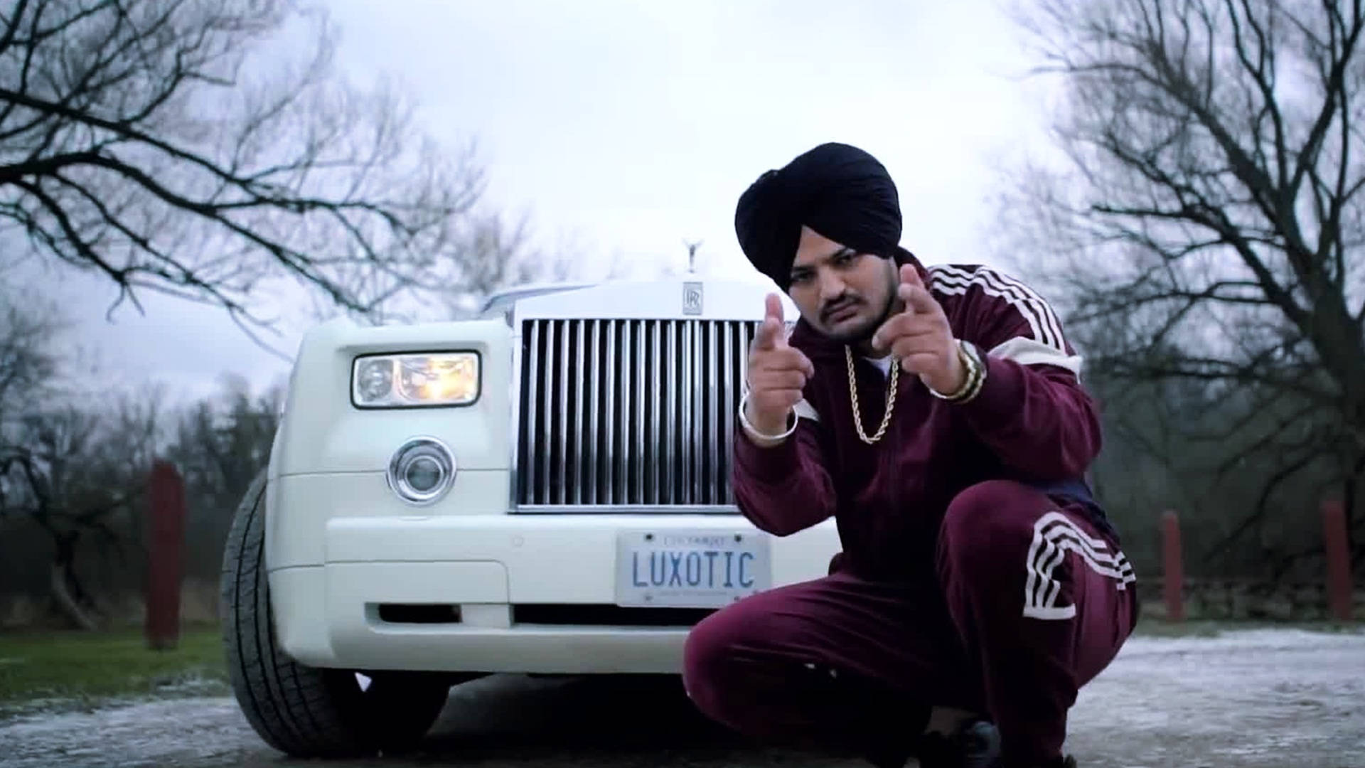 Sidhu Moose Wala With A Rolls Royce Background