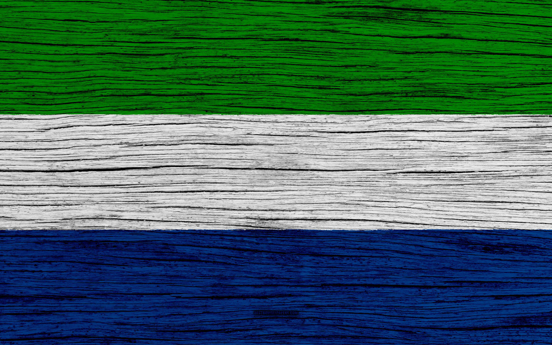 Sierra Leone Flag On Wooden Surface Background