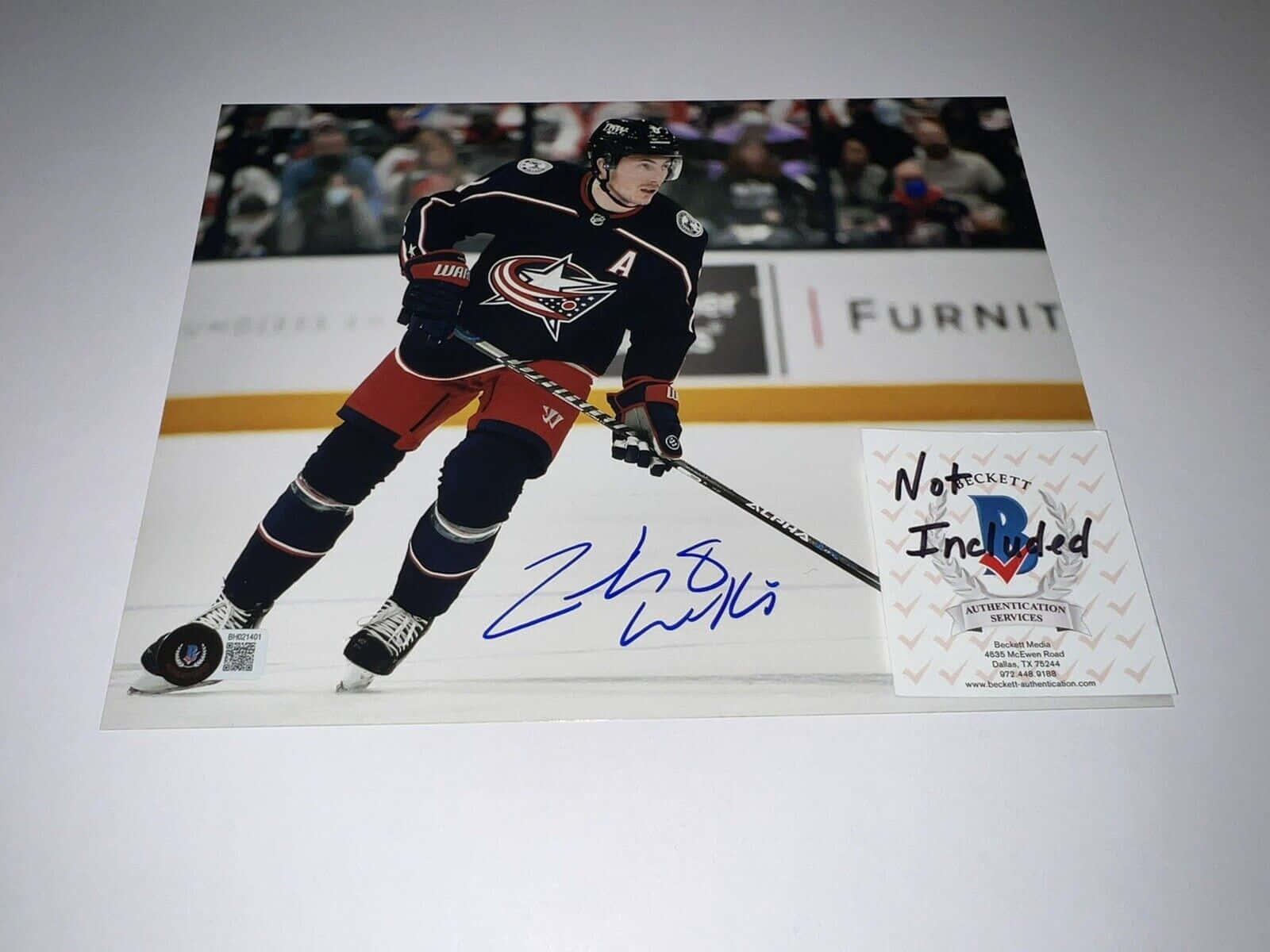 Signed Poster Of Zachary Werenski On Wall Background