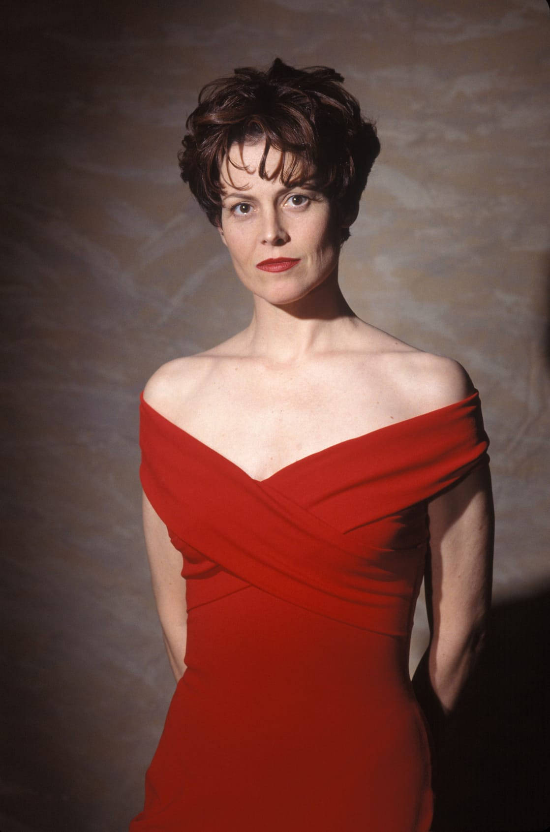 Sigourney Weaver Daring Red Dress Background