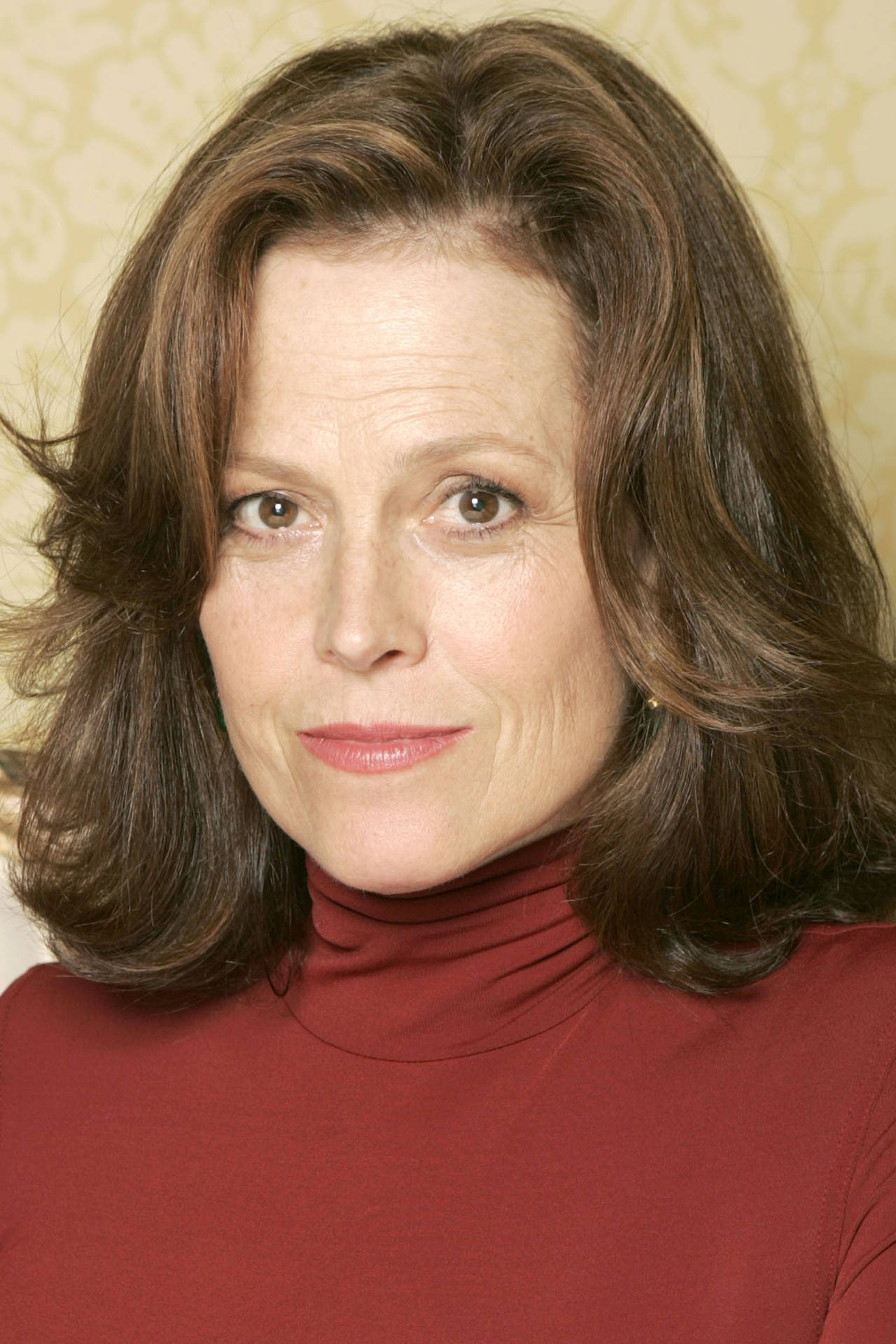 Sigourney Weaver Red Turtleneck Background