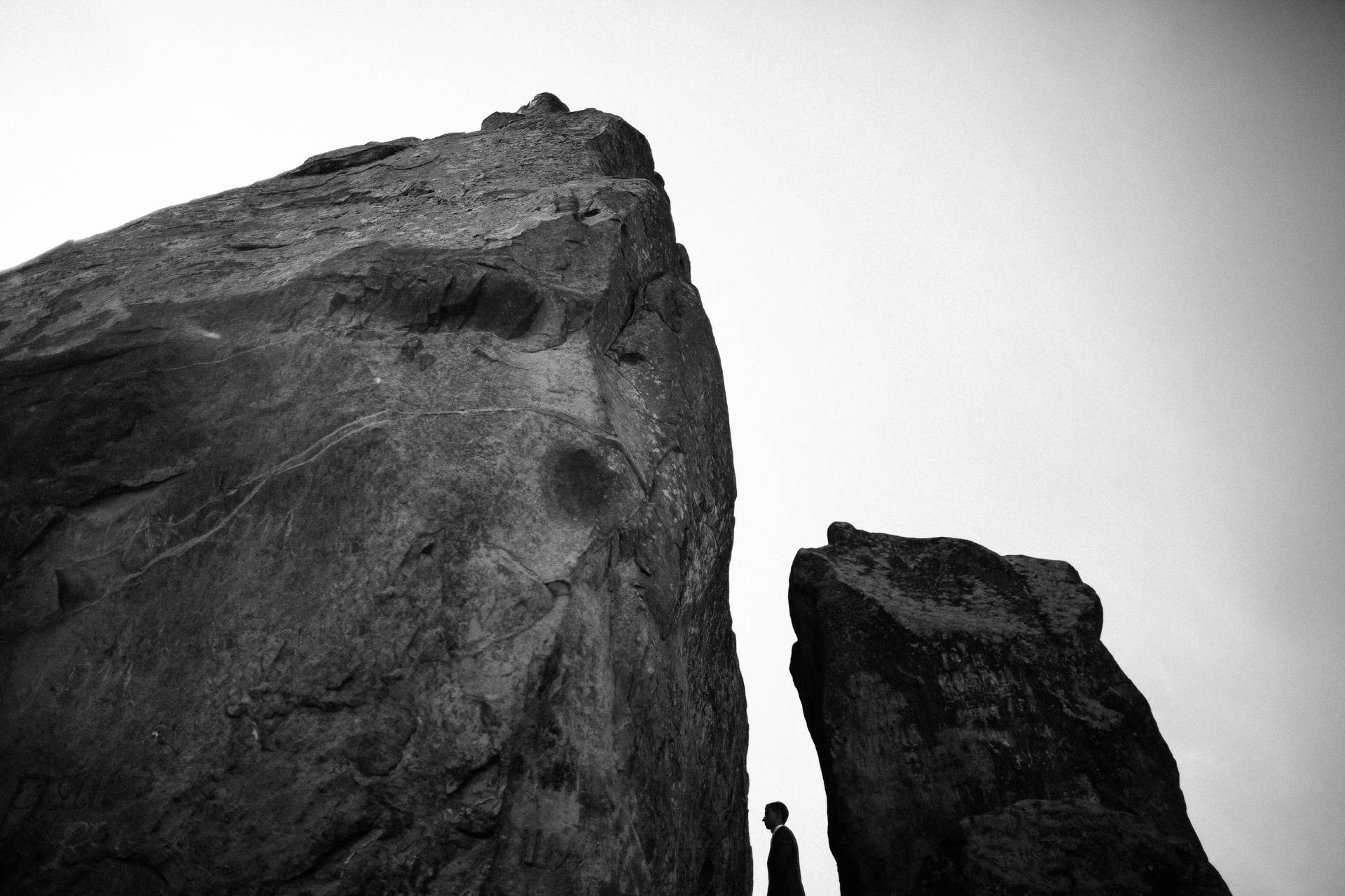Silhouette Man On The Rocks Background