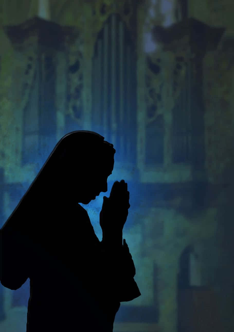 Silhouette Of A Nun Woman Praying