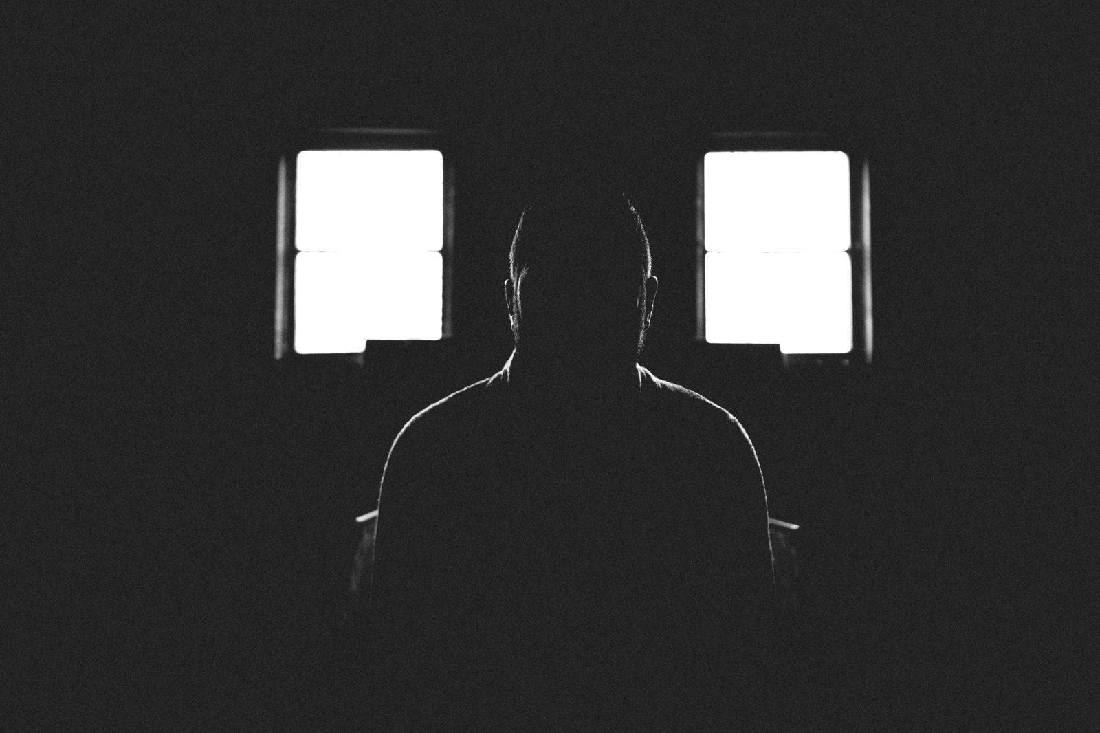 Silhouette Of A Person In Shadowed Room