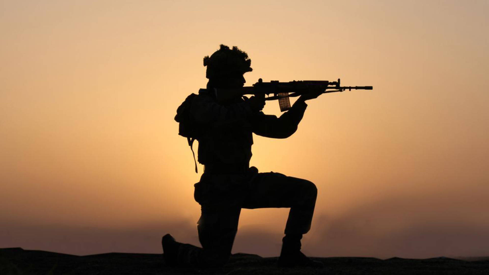 Silhouette Of A Soldier While Shooting Background