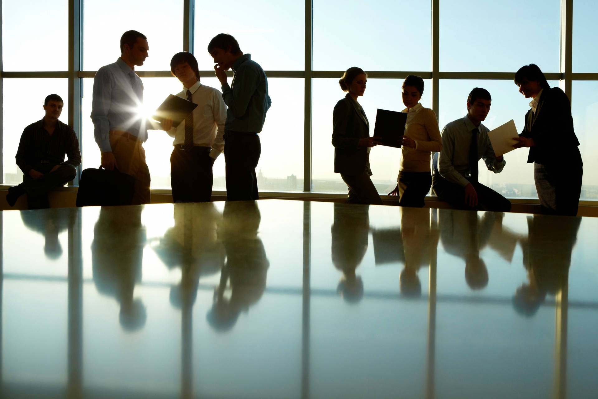 Silhouette Of Business Professionals Against Urban Skyline