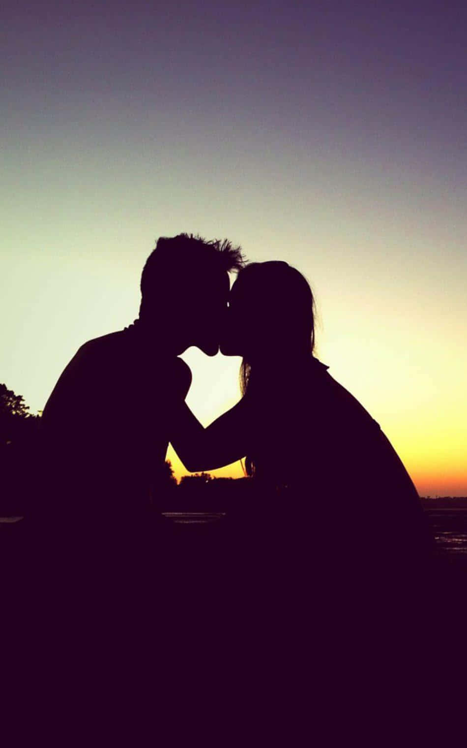 Silhouette Of Couple Kissing Each Lips Background