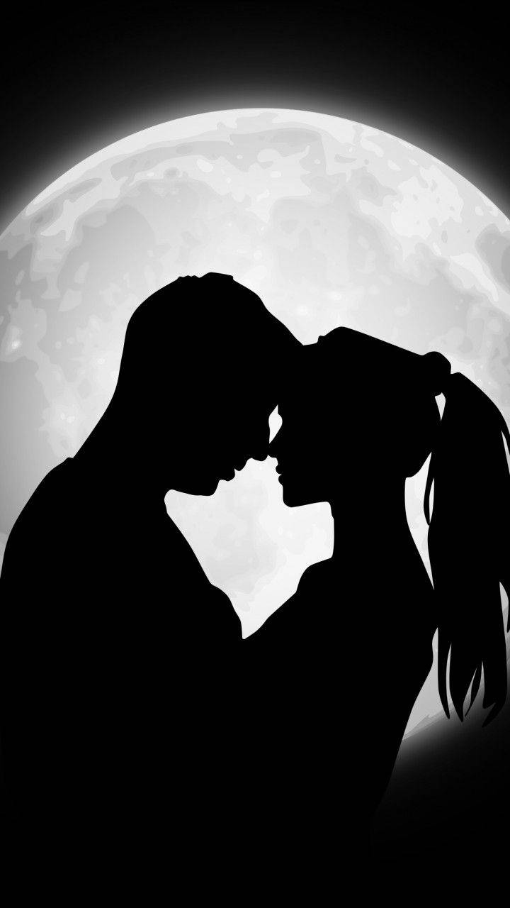Silhouette Of Cute Couple In Moonlight Background