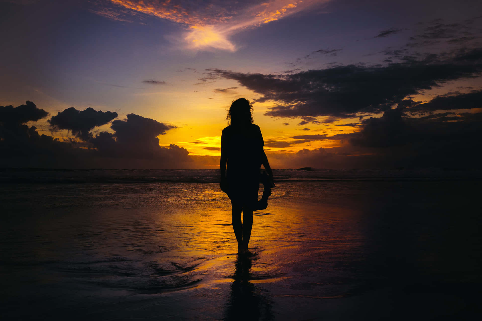 Silhouette Of Girl On Beach's Beautiful Sunset