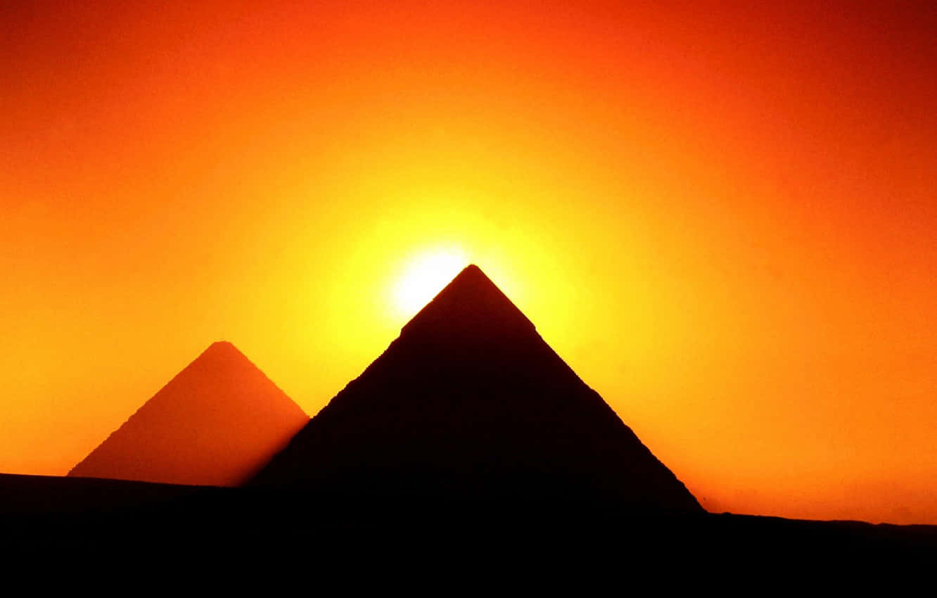 Silhouette Of Giza Pyramids At Sunset