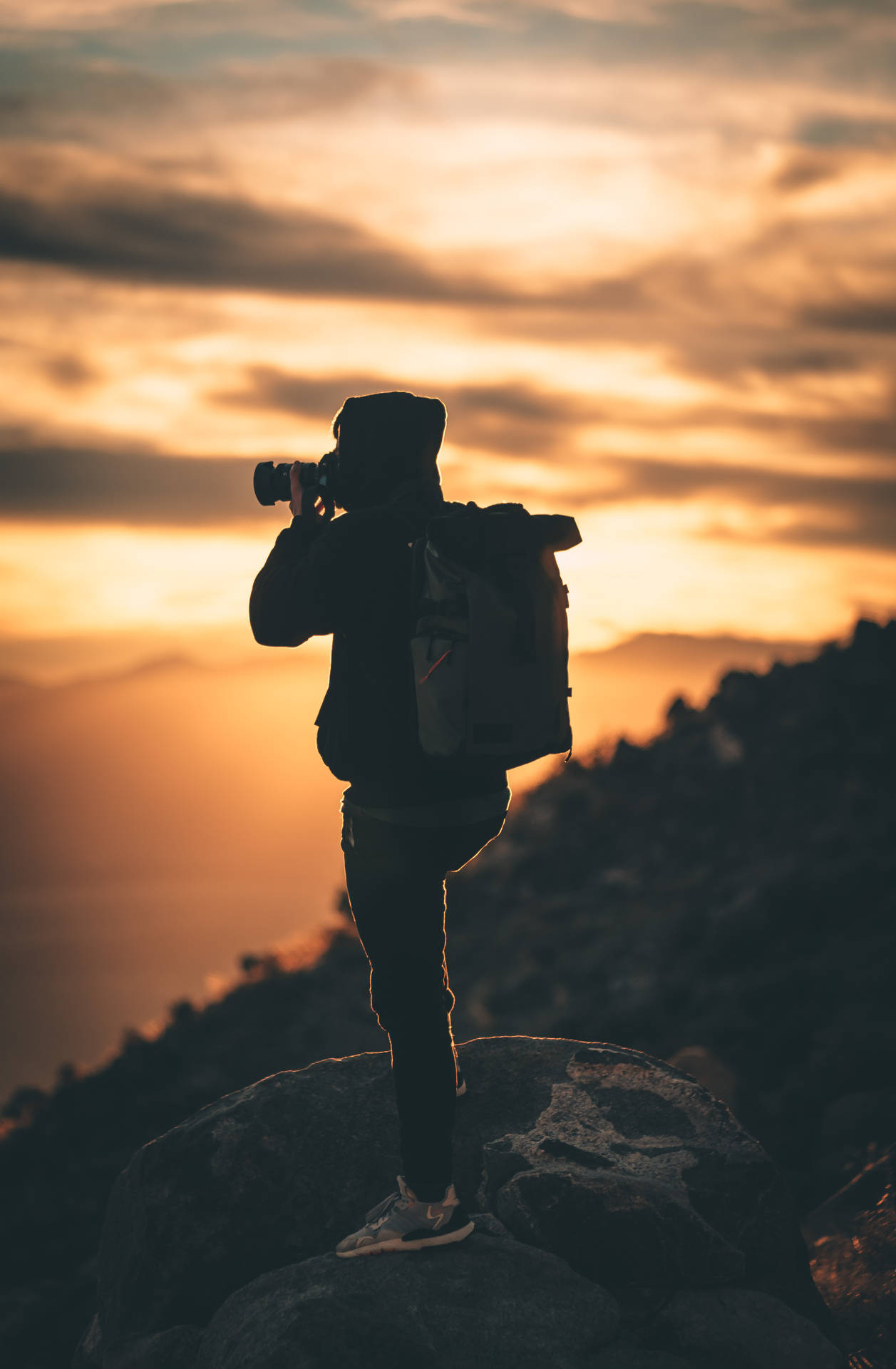 Silhouette Of Man Holding Camera During Sunset Photography Background